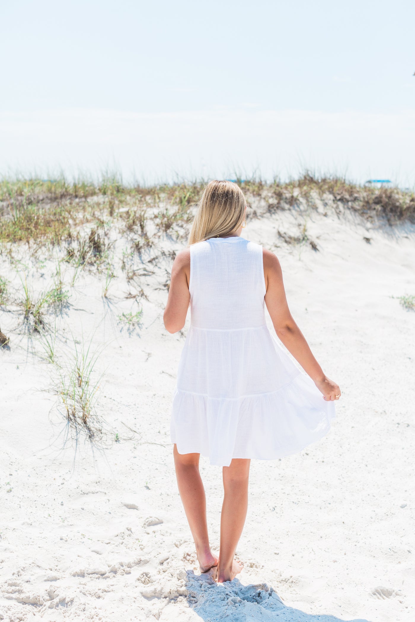 Sleeveless White gauze dress with Tassels