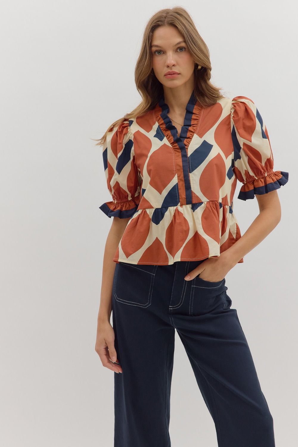 Abstract Print Peplum Top with Contrast Ruffle Trim along V-Neck